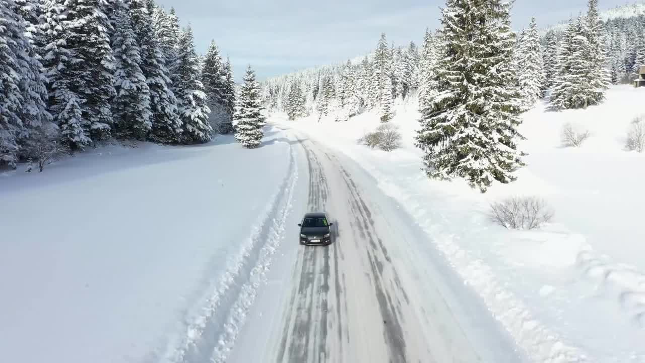 car-driving-on-a-snowy-mountain-road-stock-video-motion-array