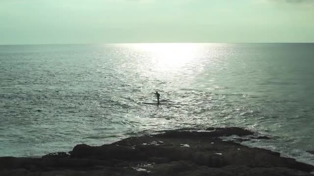 Man Paddle Boarding: Stock Video