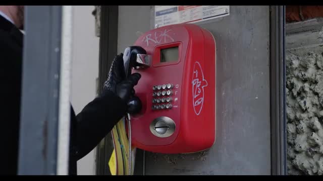 Man Uses Public Phone: Stock Video