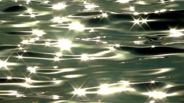 Light Gleams Off The Sea: Stock Video