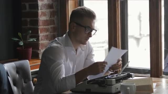 Writer Works On Novel: Stock Video