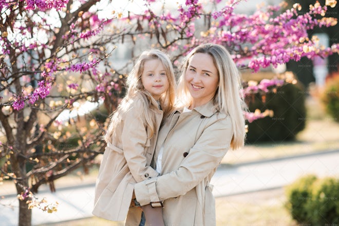 Woman Hold Kid Girl Outdoor - Stock Photos | Motion Array