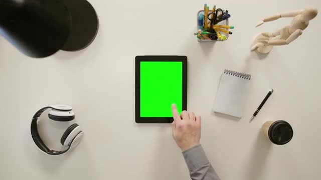 A Finger Touching A Tablet: Stock Video