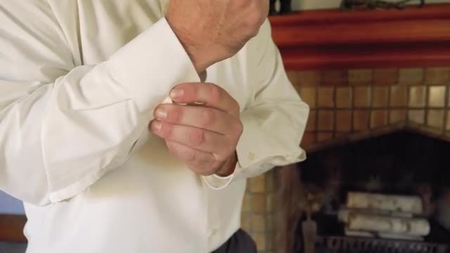 Man Buttoning His Shirt: Stock Video