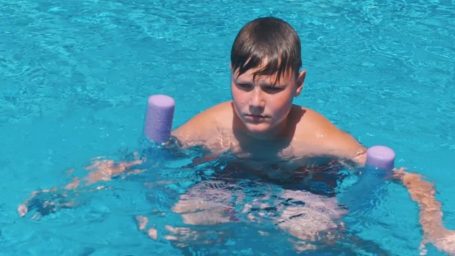Boy In Pool - Stock Video | Motion Array