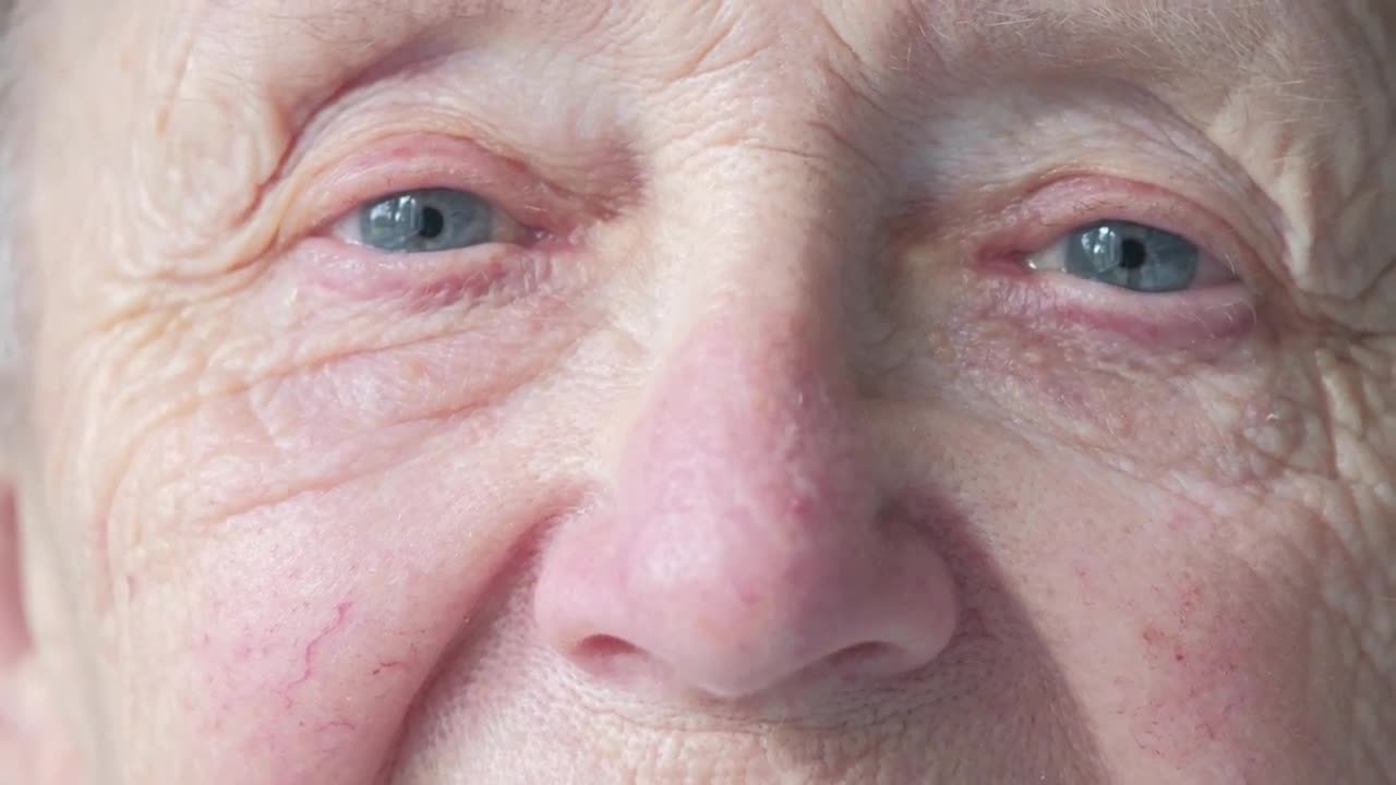 Old Woman Opens Eyes - Stock Video | Motion Array