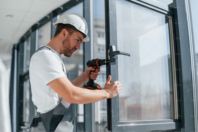 Worker Installing New Windows - Stock Photos | Motion Array