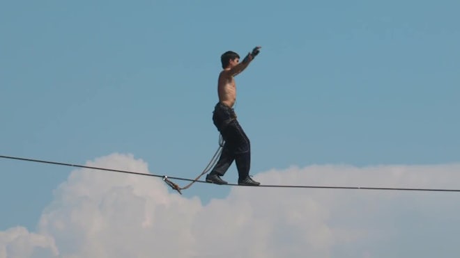 A Man Balances On Tight Rope. - Stock Video