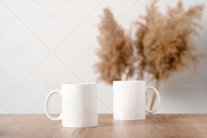 White Blank Mugs On A Table - Stock Photos