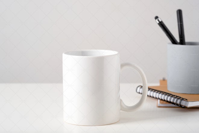 White Blank Mugs On A Table - Stock Photos
