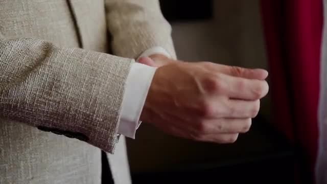 Straightens Sleeves: Stock Video