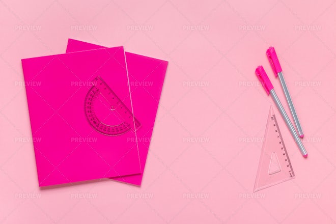 School supplies flat lay, stationery on pink background. Education