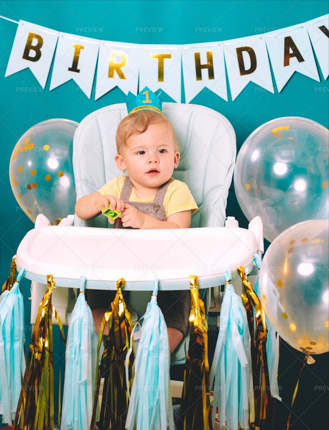 Cute Baby Boy Sitting In Chair Playing - Stock Photos | Motion Array