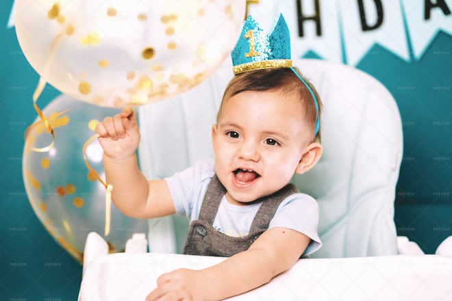 Baby Boy Sitting In Chair Playing - Stock Photos | Motion Array