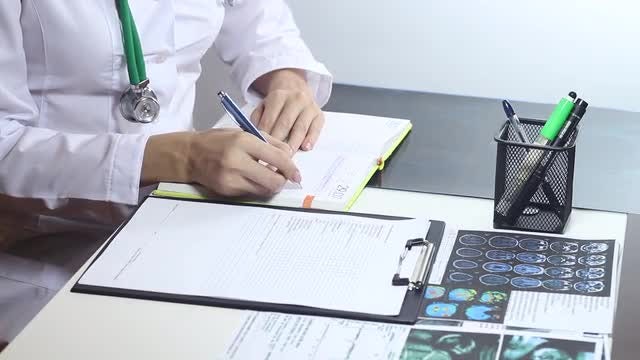 Doctor Making Notes: Stock Video