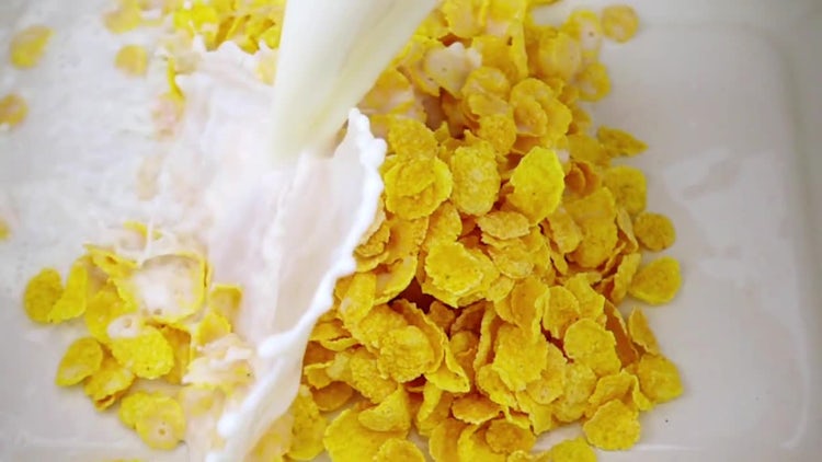 Milk Poured On Corn Flakes: Stock Video