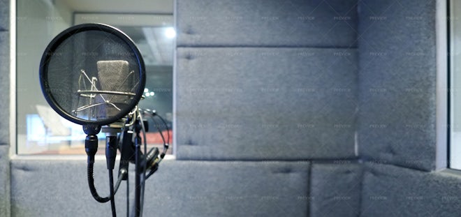 Professional studio microphone over music studio Stock Photo by