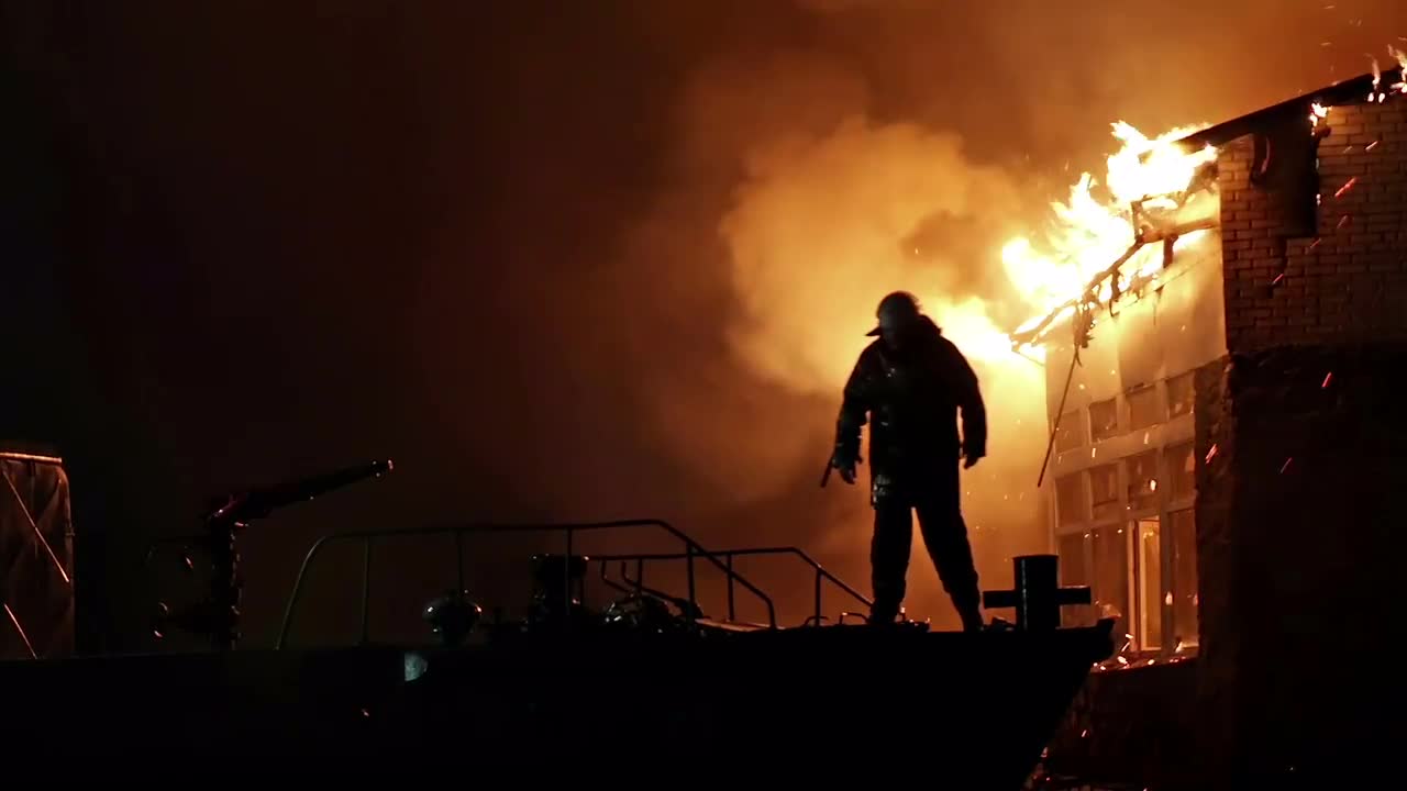 Fireman Fights Fire - Stock Video | Motion Array