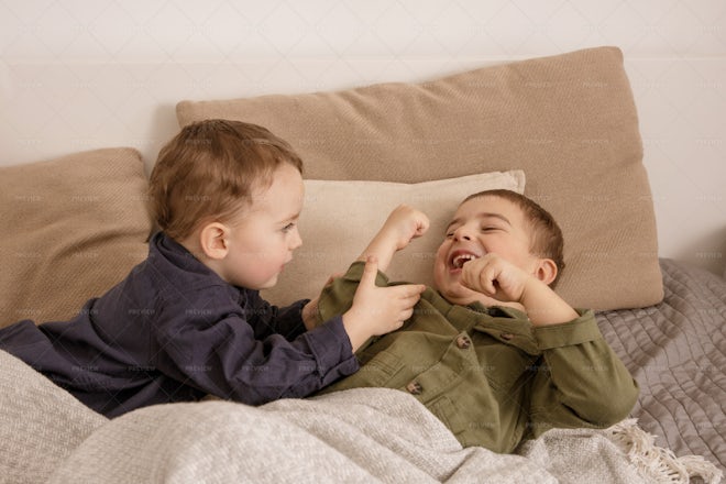 Two Little Boys Playing Together - Stock Photos | Motion Array