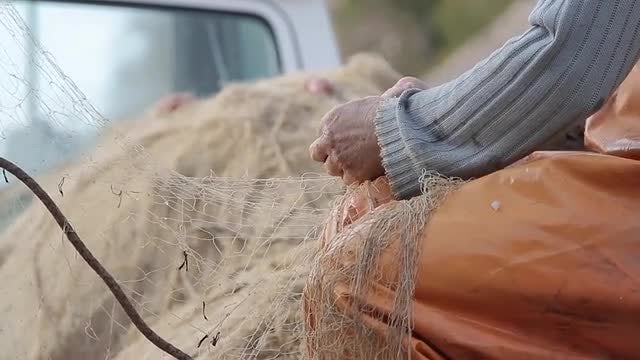 Man Prepares Net: Stock Video
