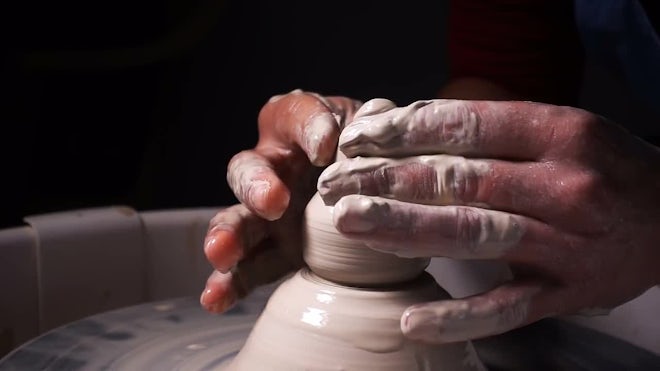 Potter molding clay on a potters wheel, Stock Video