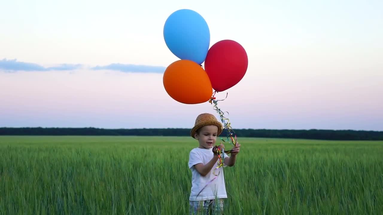 Boy Flying Balloons - Stock Video | Motion Array