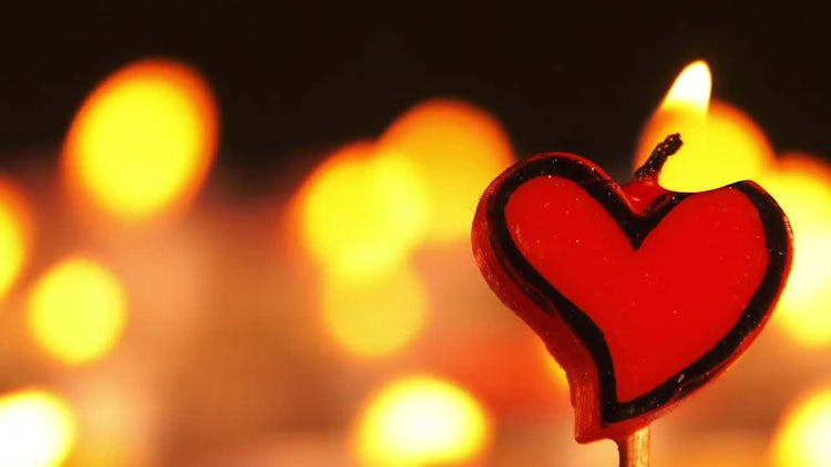 Heart-Shaped Candle: Stock Video