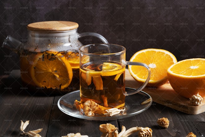 Orange tea kettle with a hot drink. Photo manipulation Stock Illustration