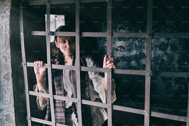 Woman Behind Prison Bars - Stock Photos 