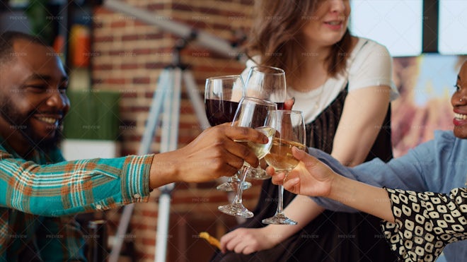 Businesswoman drinking from large wine glass with straw stock