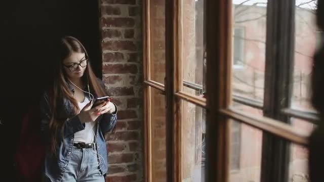Girl Standing By Window: Stock Video