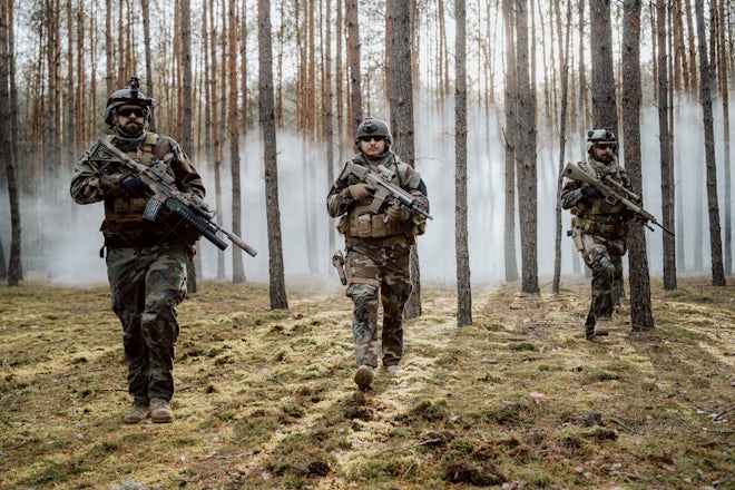 Squad Of Four Fully Equipped Soldiers - Stock Photos | Motion Array