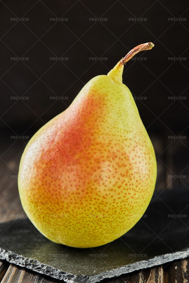 Fresh organic pears background. Ripe yellow large pears in wooden