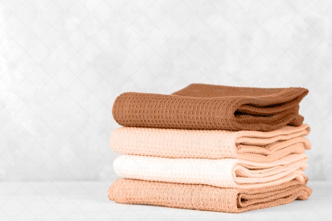 Premium Photo  Collection of natural muslin kitchen towels stacked neatly  in a vertical stack