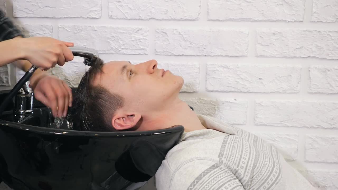 Barber Washes Head Stock Video Motion Array