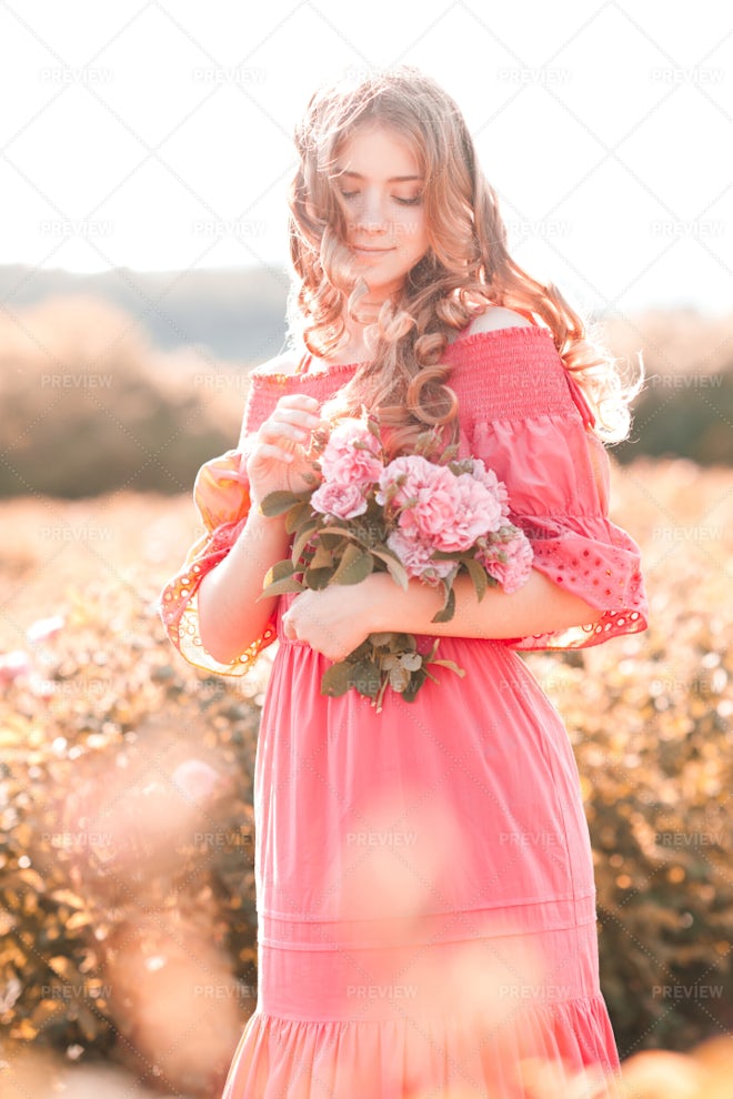 Girl Holding Rose Flowers - Stock Photos | Motion Array