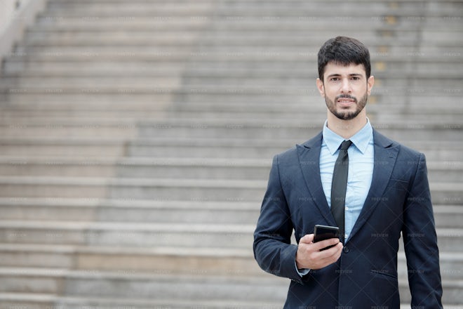 Young Entrepreneur With Smartphone - Stock Photos | Motion Array