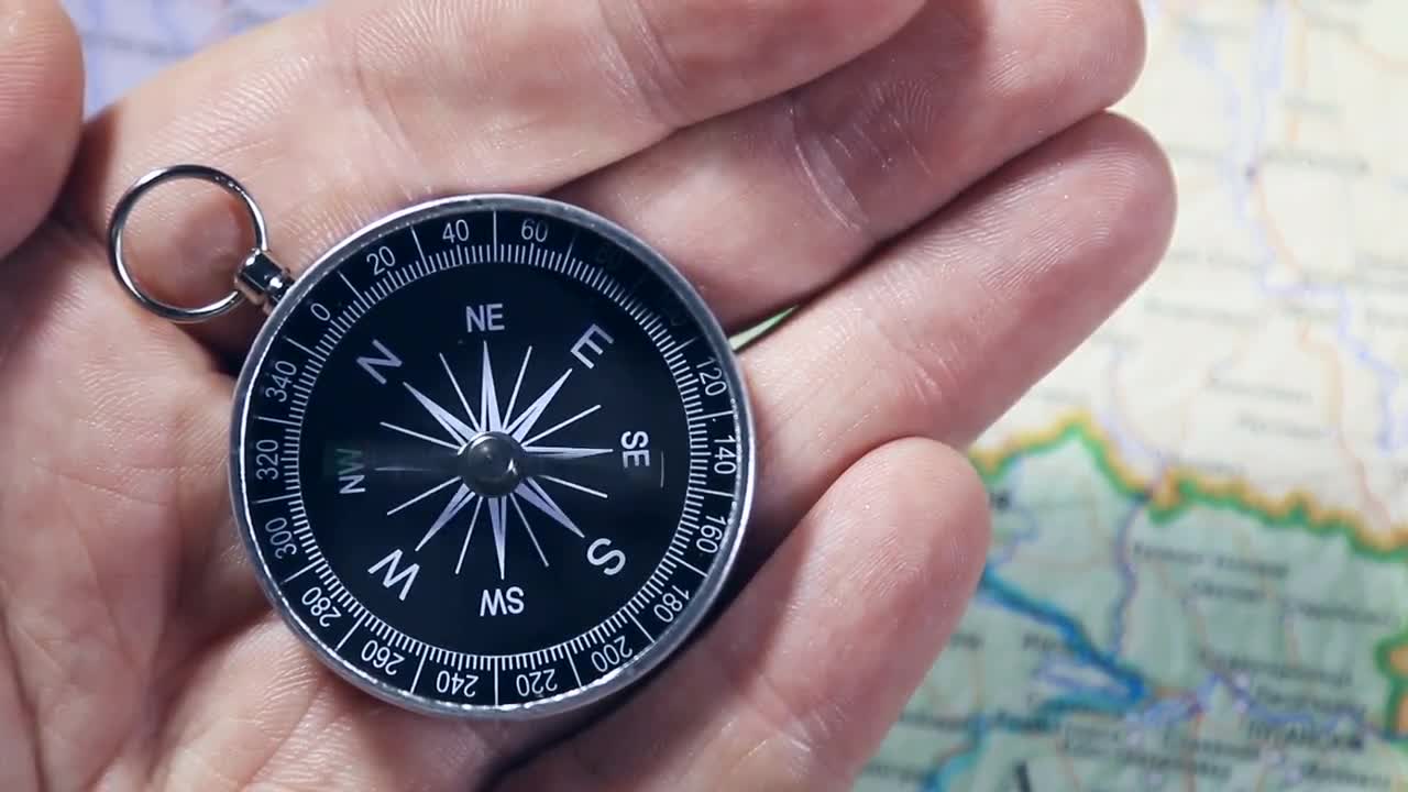 compass-needle-finding-north-stock-video-motion-array