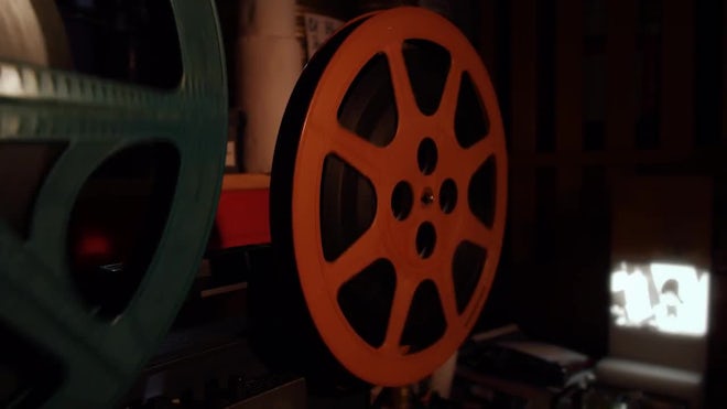 Film Projector Reels Turning Behind Stock Footage Video (100