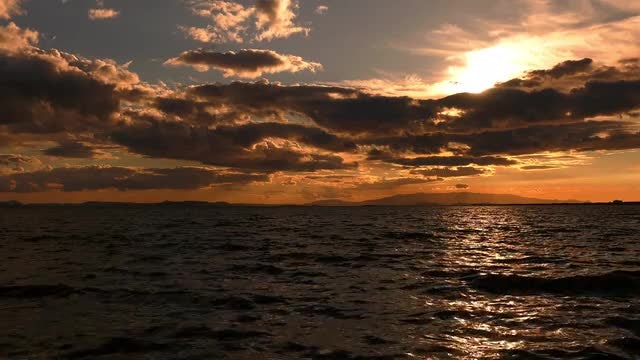 Orange Sky And Dark Sea: Stock Video