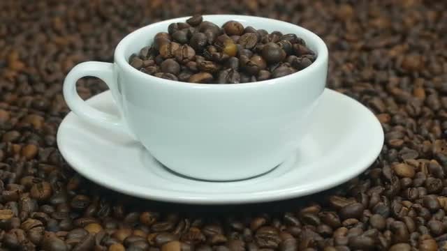 Cup With Coffee Beans: Stock Video