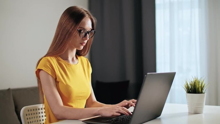 Woman Works On Laptop: Stock Video
