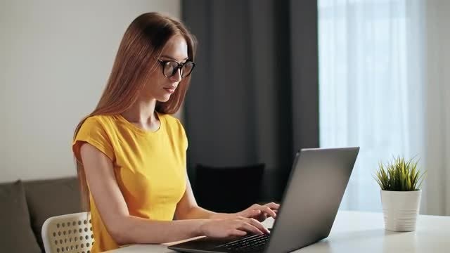 Woman Works On Laptop: Stock Video