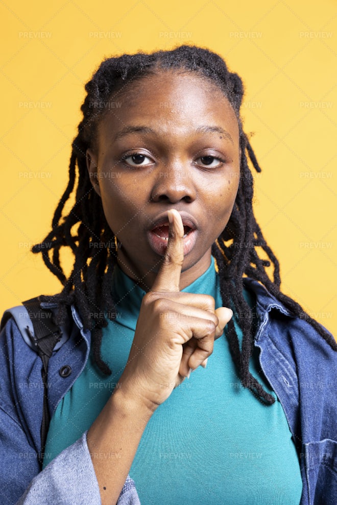 Portrait Of Girl Doing Shushing Hand Gesturing, Requesting Silence ...