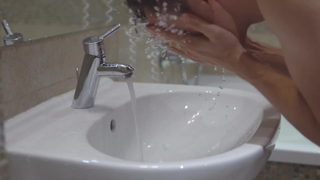 Washing Face In Sink - Stock Video | Motion Array