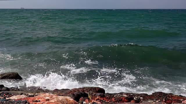 Waves Crashing Onto Rocks: Stock Video