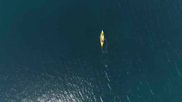 Yellow Kayak At Sea: Stock Video