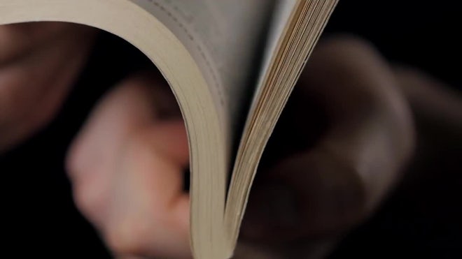 Two hands opening a book with blank page, Stock Video