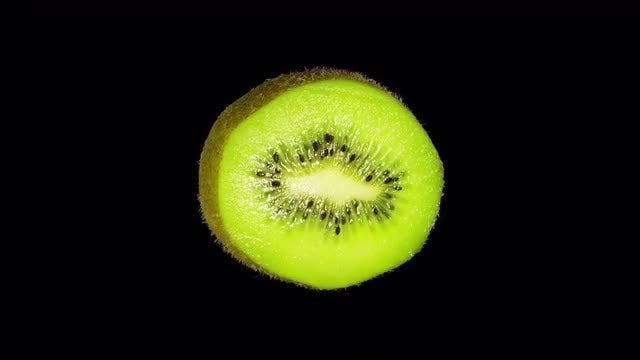 Isolated Kiwi Slice: Stock Video