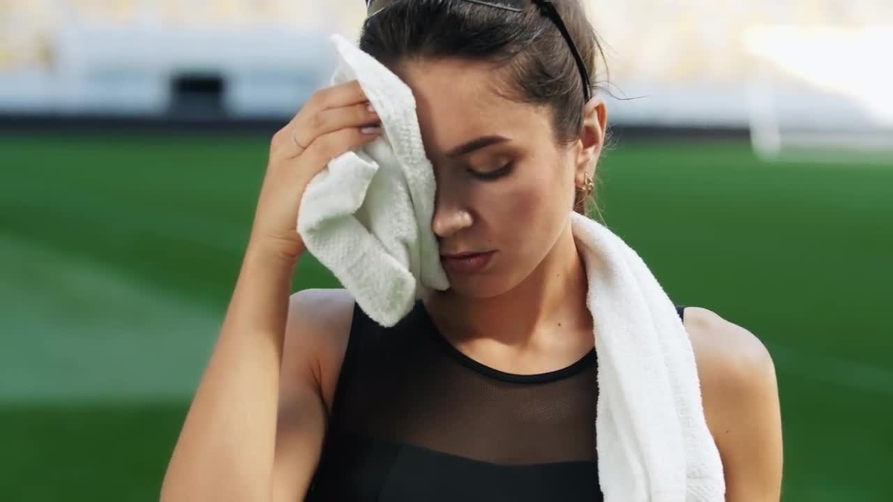 Athletic Woman Wiping Her Sweat Stock Video Motion Array 